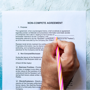 hand filling out a noncompete agreement