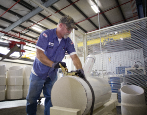 Employee working on pipe at Charlotte Pipe and Foundry