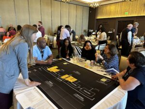 Group of professionals discussing a plan around a table