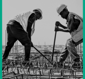 two men working on construction of a building